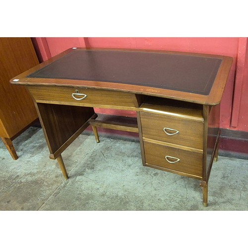 19 - A tola wood and black vinyl topped desk