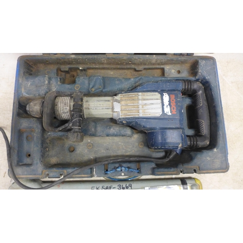 5028 - A Bosch 240V concrete breaker - with case and a radio detection cable avoidance tool