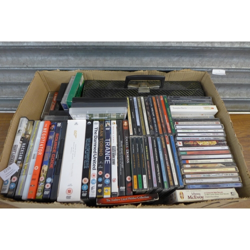 5214 - A box of assorted DVDs, CDs and tapes