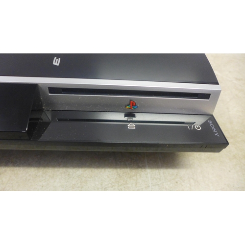 5061 - A Playstation 3 games console and a quantity of games including Tiger Woods PGA Tour 11, 13 and 14, ... 