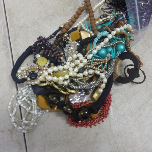 5075 - Two bags of assorted costume jewellery