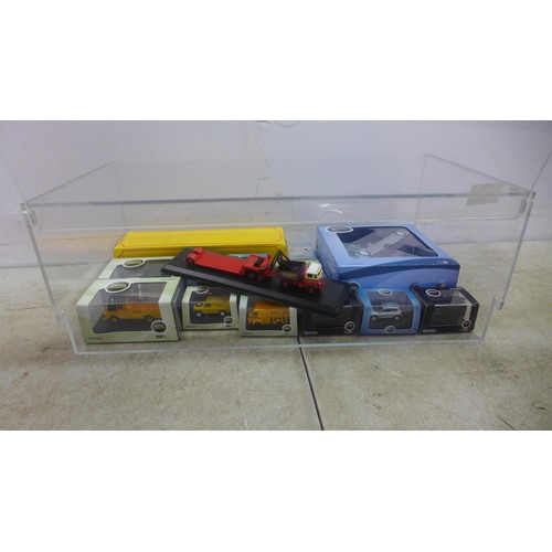 5056A - A collection of Oxford scale models in perspex display case including an AFS Austin ATV, a Nissan Qa... 