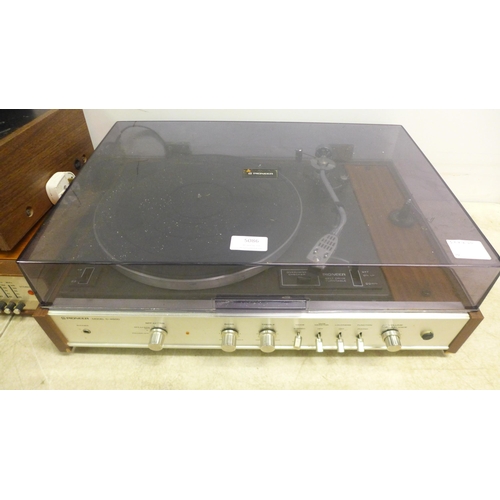 5086 - A quantity of stereo equipment including a Pioneer model C-4500 belt driven turntable record player,... 