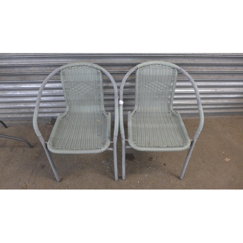 5185 - A circular glass topped bistro garden table and two bistro garden chairs