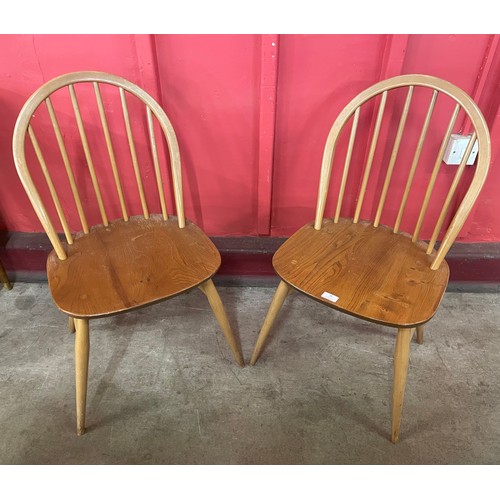 26 - A pair of Ercol Blonde elm and beech Windsor chairs