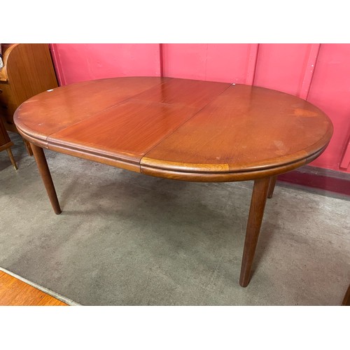 45 - A Danish teak circular extending dining table