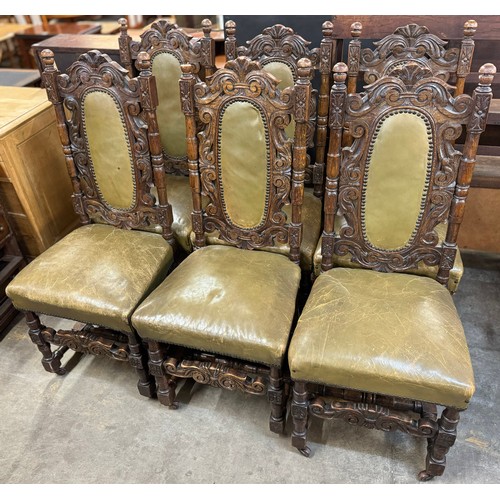 143 - A set of six Carolean style carved oak and green leather upholstered dining chairs