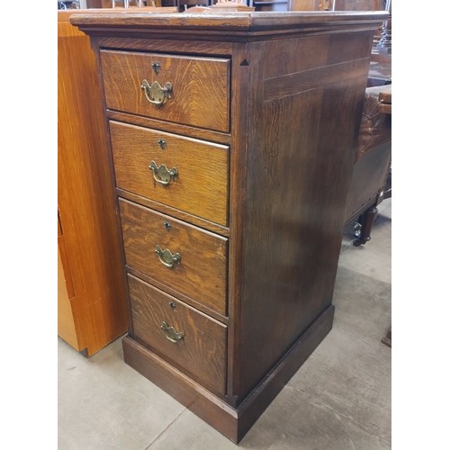 147 - An Edward VII oak four drawer pedestal chest