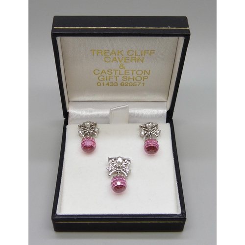 1003 - A pair of pink and clear glass stone set earrings and a matching pendant