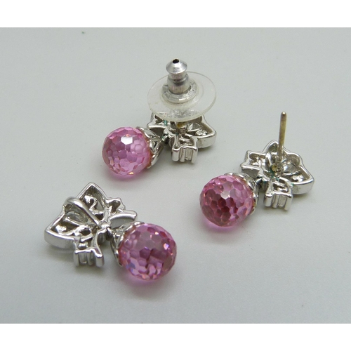 1003 - A pair of pink and clear glass stone set earrings and a matching pendant