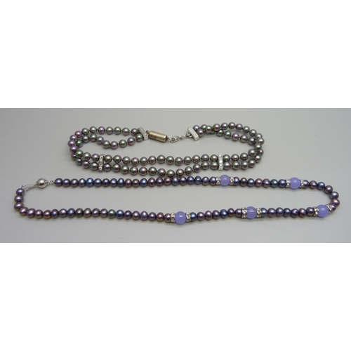 1006 - A black cultured pearl and amethyst necklace on a plated clasp, and a silver mounted and crystal fau... 