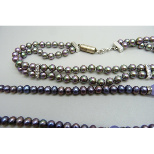 1006 - A black cultured pearl and amethyst necklace on a plated clasp, and a silver mounted and crystal fau... 