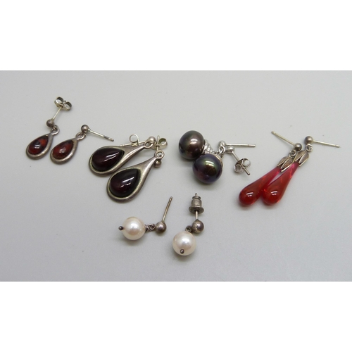 1007 - Two pairs of silver drop earrings, together with three pairs of white metal earrings including pearl... 