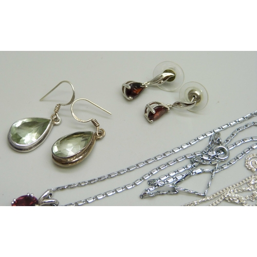 1011 - Two pairs of silver earrings including one pair set with garnets, a plated red stone pendant and cha... 