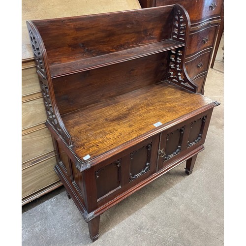 149 - A Victorian walnut two door fretwork side cabinet