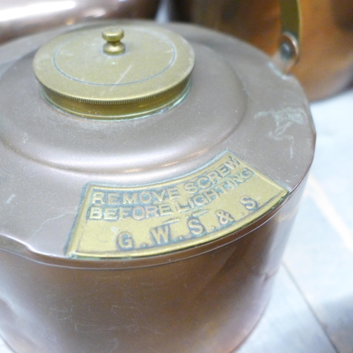 1037 - A collection of eight copper kettles, pan lid and crumb scoop **PLEASE NOTE THIS LOT IS NOT ELIGIBLE... 