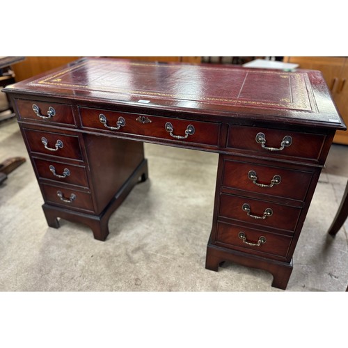 152 - A Regency style mahogany and red leather topped pedestal desk