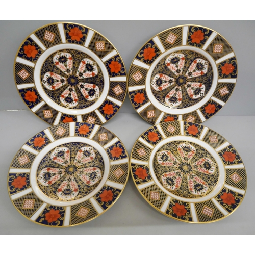 621 - A set of four Royal Crown Derby 1128 pattern tea plates, three seconds, one first quality