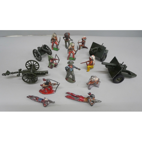 644 - A collection of metal models of Native Americans, Cowboy and four Britains field guns