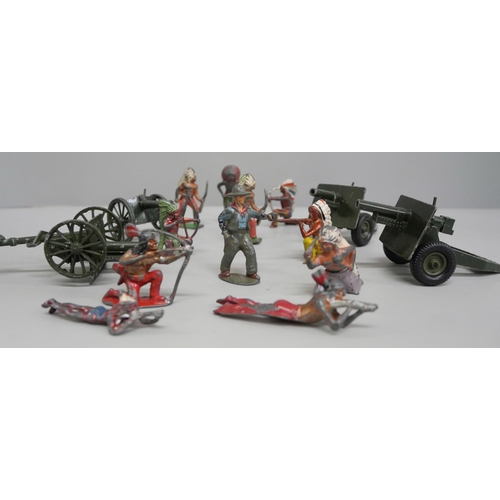 644 - A collection of metal models of Native Americans, Cowboy and four Britains field guns