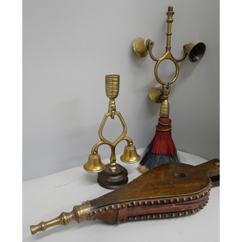 646 - A small pair of bellows and two sets of horse terrets, one with triple bell, swinger and red, white ... 