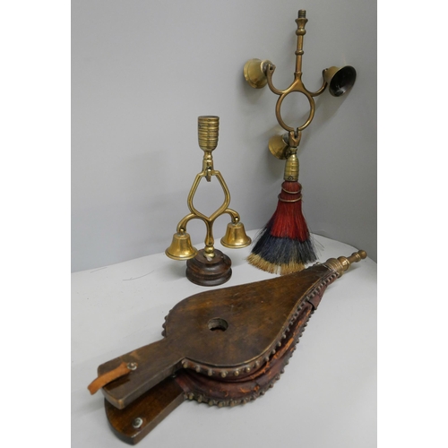 646 - A small pair of bellows and two sets of horse terrets, one with triple bell, swinger and red, white ... 