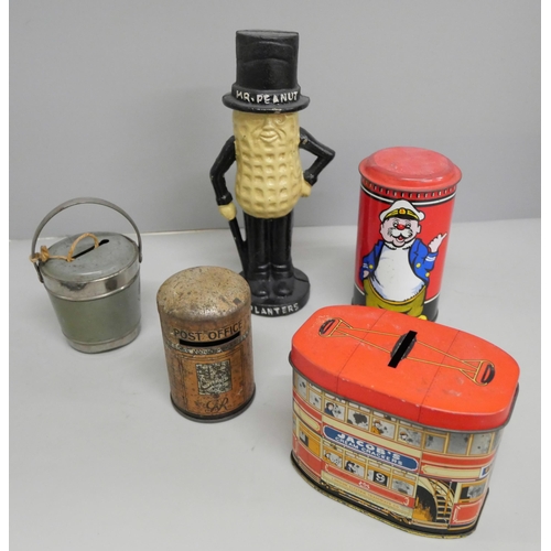 649 - A collection of five vintage money boxes including Mr Peanut, Coleman Mustard, Jacobs Crackers of bo... 