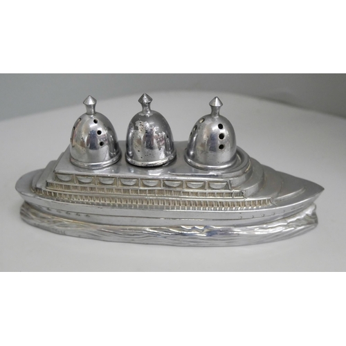 655 - A plated four bottle cruet and other plated items including ocean liner cruet