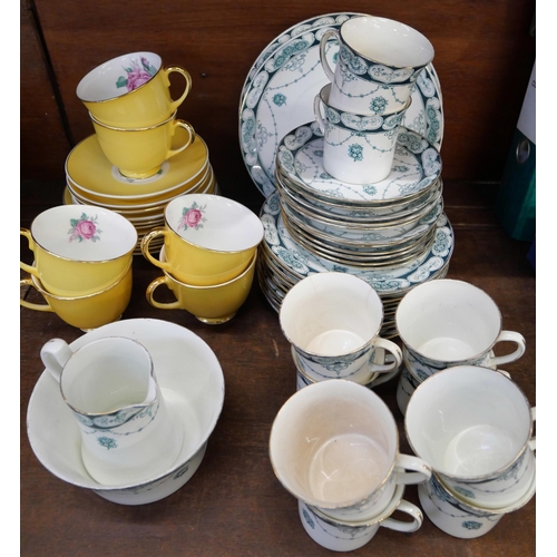 669 - A Jason bone china yellow ground tea set decorated with roses and an Edwardian tea set, ten cups, el... 