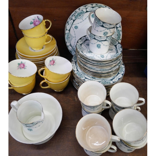 669 - A Jason bone china yellow ground tea set decorated with roses and an Edwardian tea set, ten cups, el... 