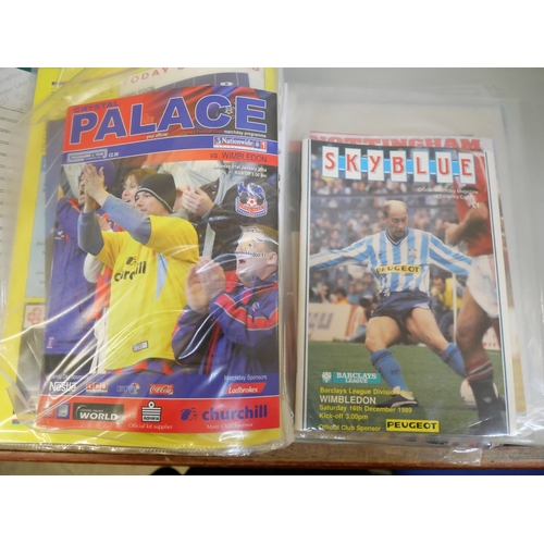 670 - An album containing Wimbledon F.C. autographs and football programmes