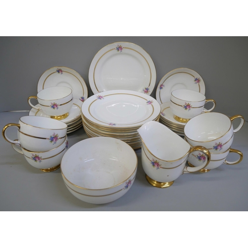 678 - A Paragon ten setting tea set, two cups a/f