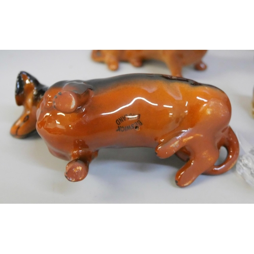 679 - A collection of Dachshund figures, including six Beswick and other metal