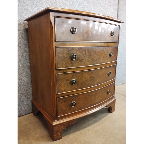 110 - A George III style burr walnut bowfront chest of drawers