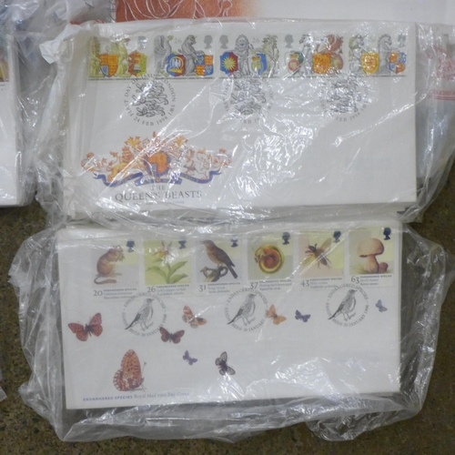 687 - A carton of approximately 500 first day covers 2000-2004 with most sets duplicated, all unaddressed,... 