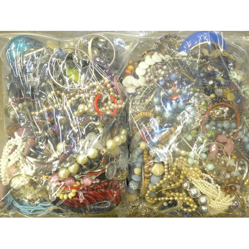 705 - Two bags of costume jewellery