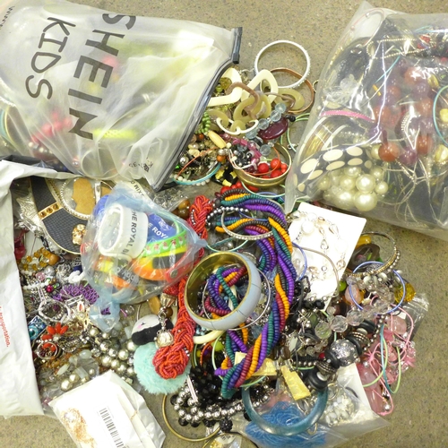 710 - Three bags of costume jewellery