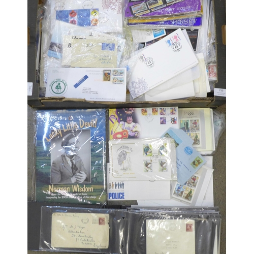 712 - A box of mixed first day covers, stamps, presentation packs, etc., also noted some USA stamps, an al... 