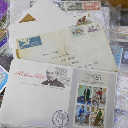 712 - A box of mixed first day covers, stamps, presentation packs, etc., also noted some USA stamps, an al... 