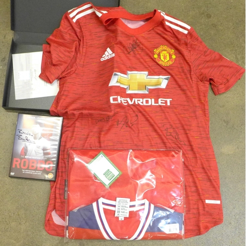 736 - A replica 1980's England football shirt signed by Bryan Robson, also a signed DVD and a signed Manch... 