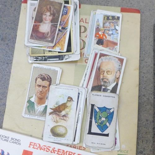 741 - A collection of cigarette cards and tea cards