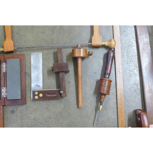 755 - Woodworking; three vintage set squares, bow saw, blade sharpener in box, two markers, rotary drill, ... 