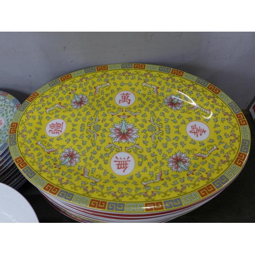 758 - A collection of oriental design banquet china, twelve large and small plates, twelve rice bowls and ... 