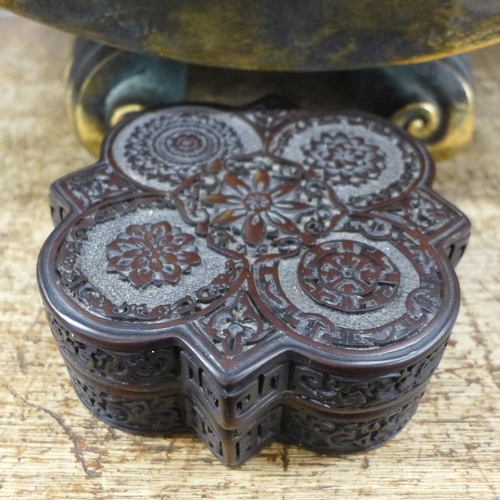 780 - A leather Venetian Mask, a South East Asian carved box and a bronzed tole