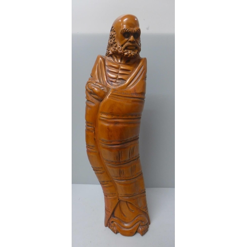 783 - A carved yew figure of a Chinese elder, 46cm