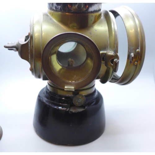 786 - A Wolf Safety Lamp Co. lamp and a rear brass lamp, circa 1905, probably Lucas