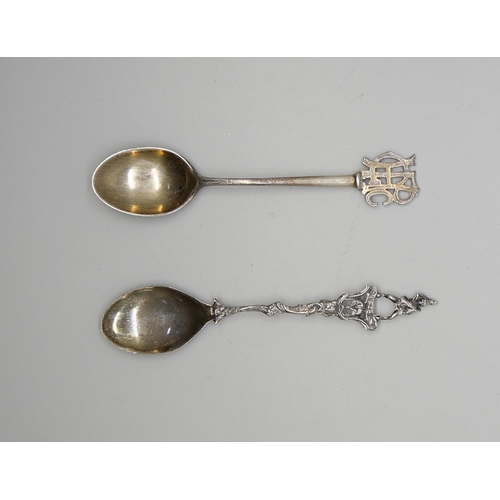 810 - A silver spoon with monogram handle and a .800 silver spoon, 24g