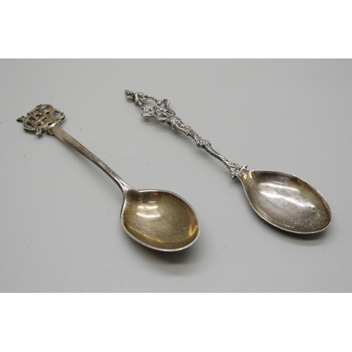 810 - A silver spoon with monogram handle and a .800 silver spoon, 24g