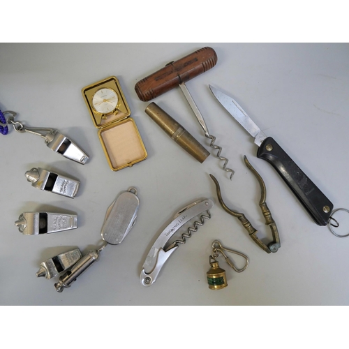 811 - A collection of pen knives, whistles, a cork screw etc.