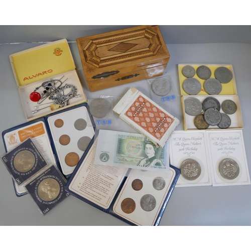 812 - A collection of coins including crowns, a £1 note, a  £5 coin, and two pre 1947 coins